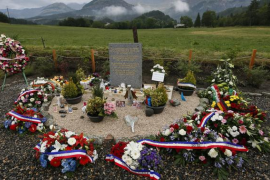 Wreaths of flowers are seen near the stele after families gathered for a ceremony in memory of the victims of the Germanwings Ai